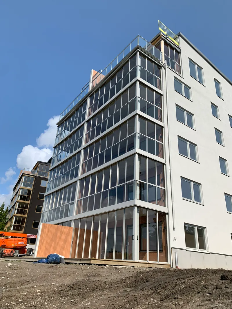 Fully glazed aluminum balcony railings with sliding frame panels — photo 1