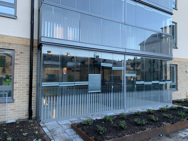 Fully glazed aluminum balcony railings with folding glass panels — photo 6